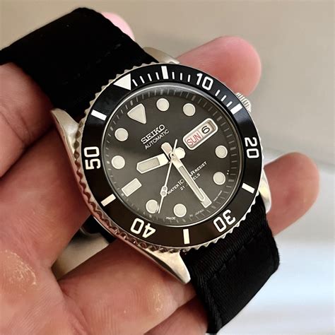 seiko skx031 vs rolex submariner|More.